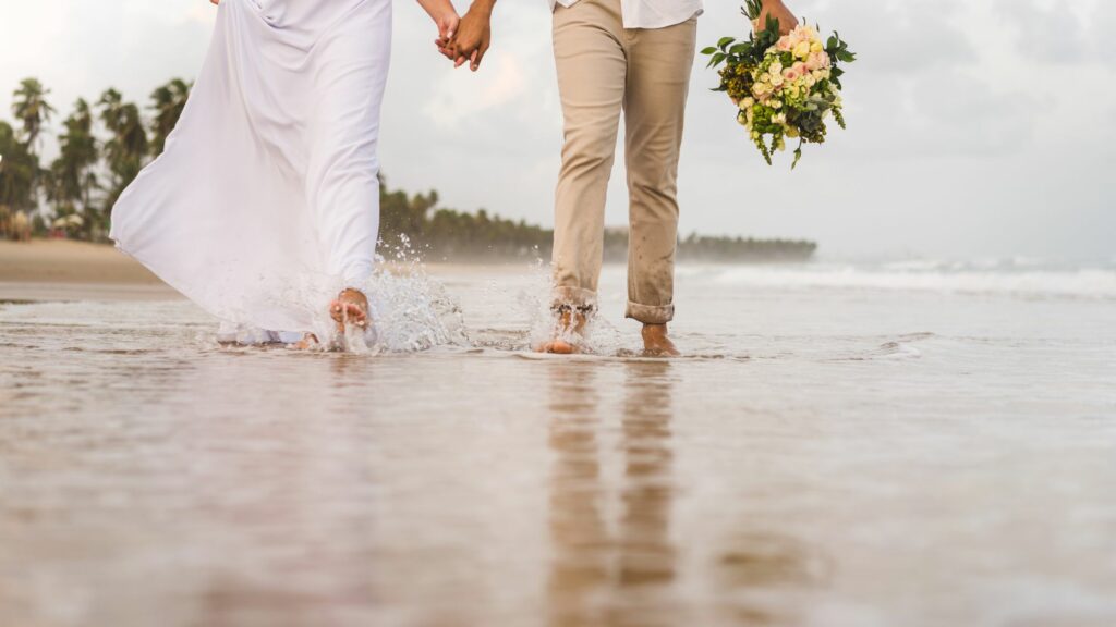 couple walking near the seashore hand in hand